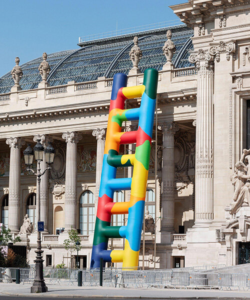 paola pivi leans 20-meter technicolor ladder against the grand palais in paris